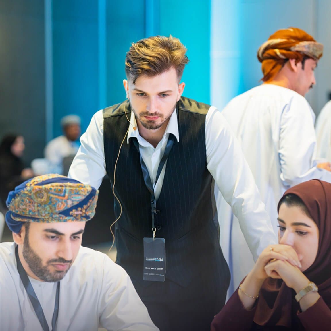 Gabriel Ceicoschi helping participants at their workstation during the hackathon