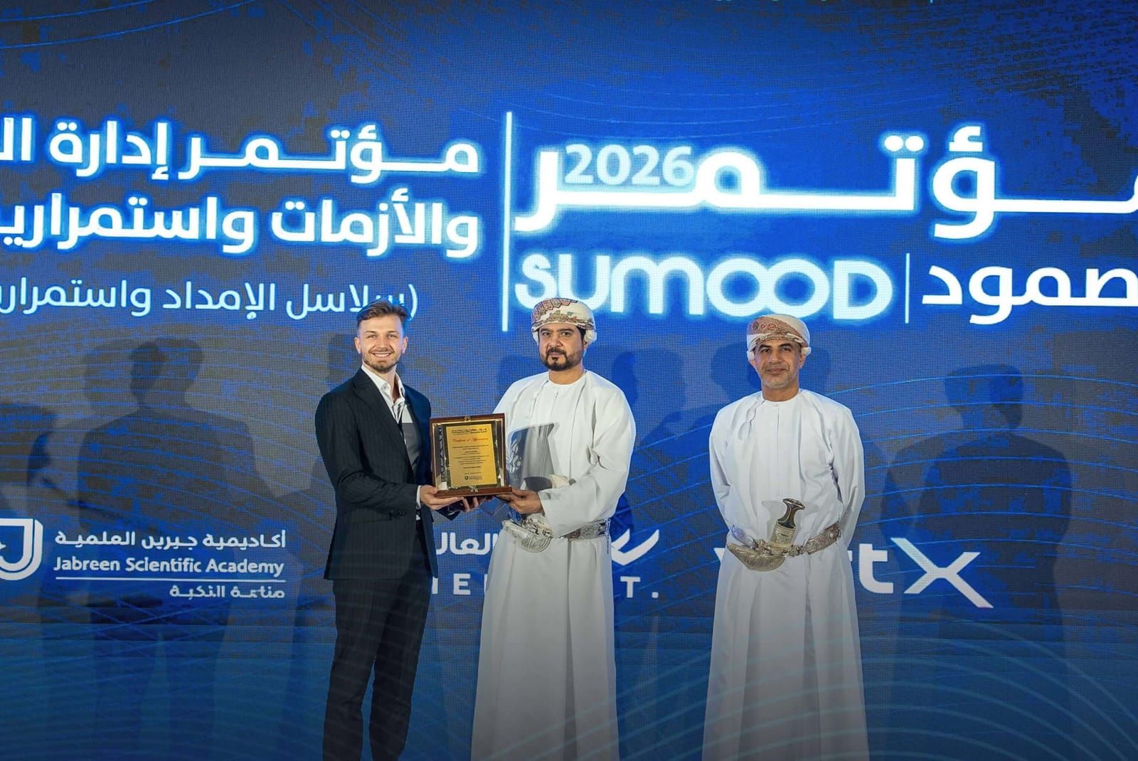 Aibl.to receives a certificate of appreciation on the Sumood 2026 stage in Muscat